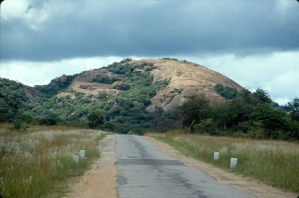 The road through the Matobo Hills, past a granite kopje